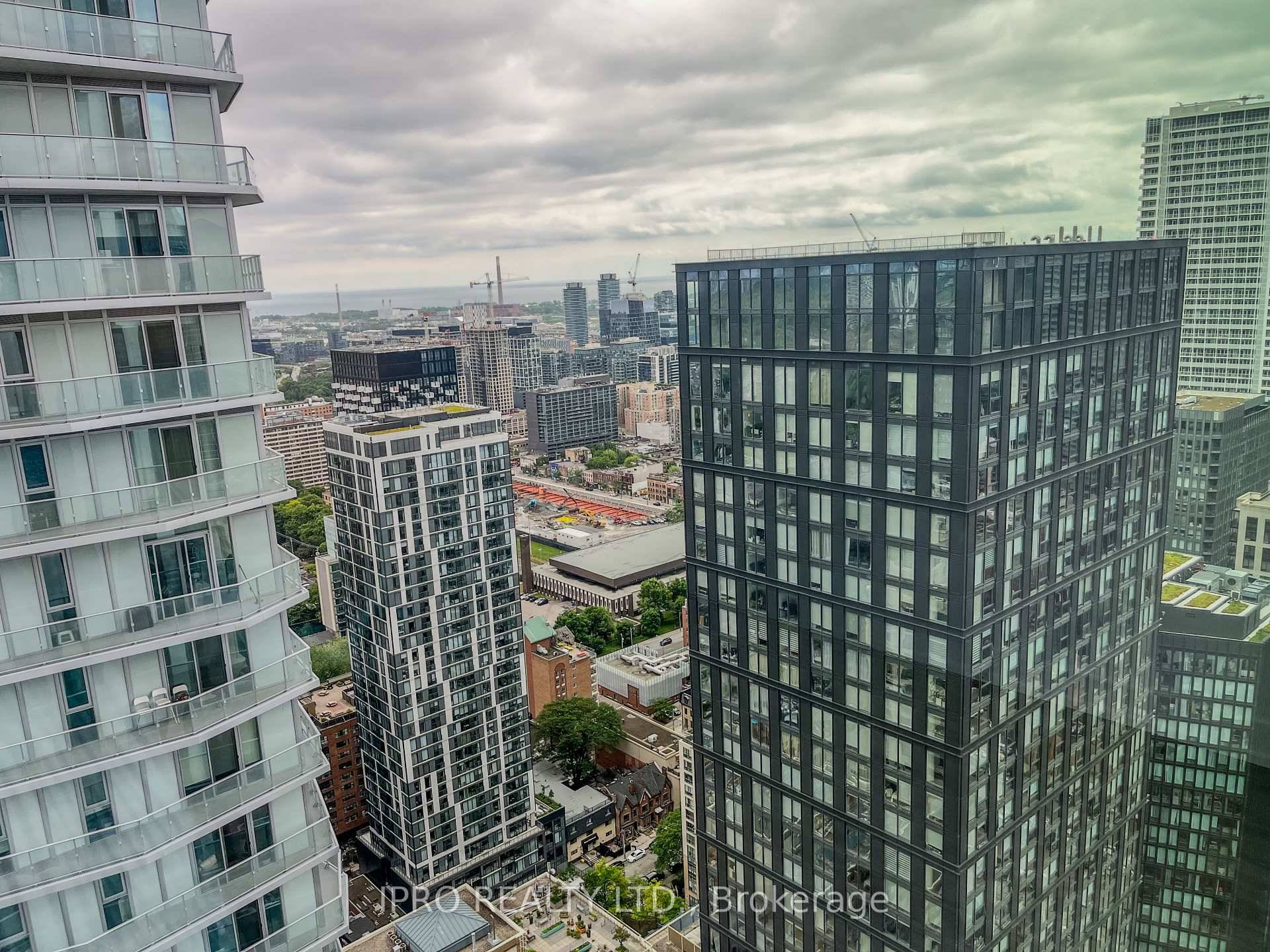 This never lived in suite features floor to ceiling windows that flood the space with natural light and offer stunning, unobstructed views of both the city skyline and the lake.