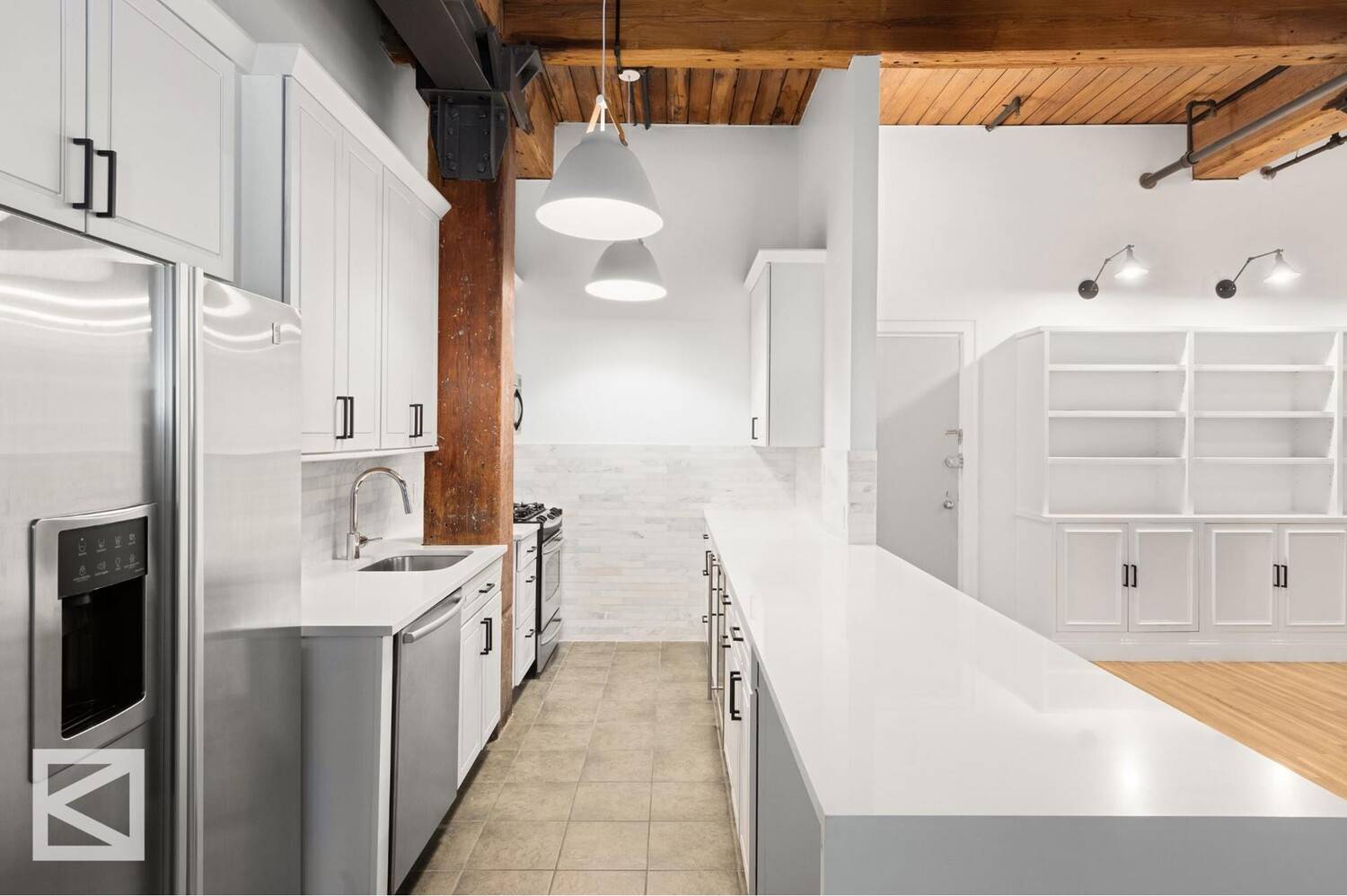 Beautifully renovated three bedroom, two bathroom corner loft, boasting soaring 12' beamed ceilings, exposed brick, two wood burning fireplaces and new oversized 8' thermal windows.