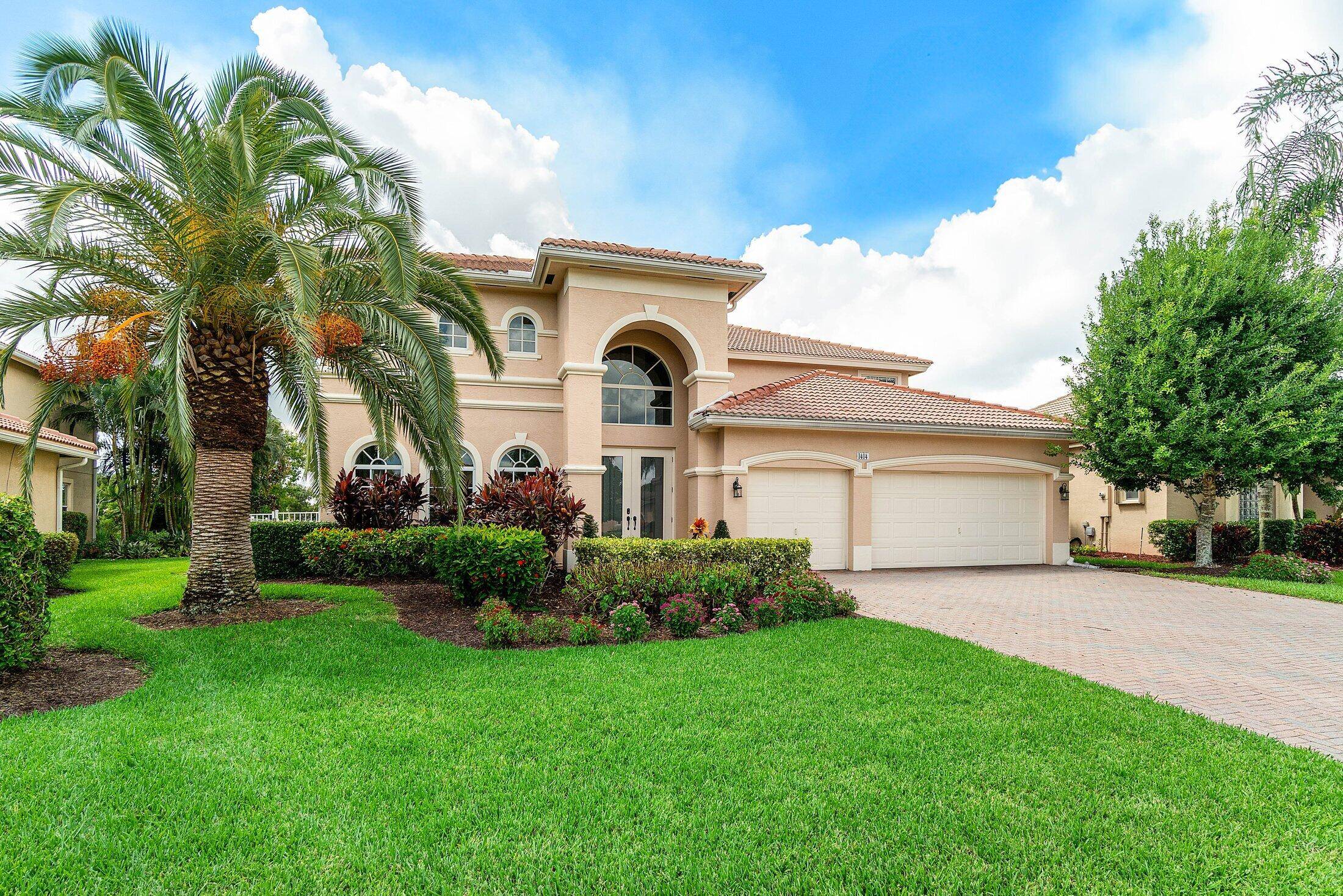 Tranquil lakefront home residing in Legacy Cove of Stuart.