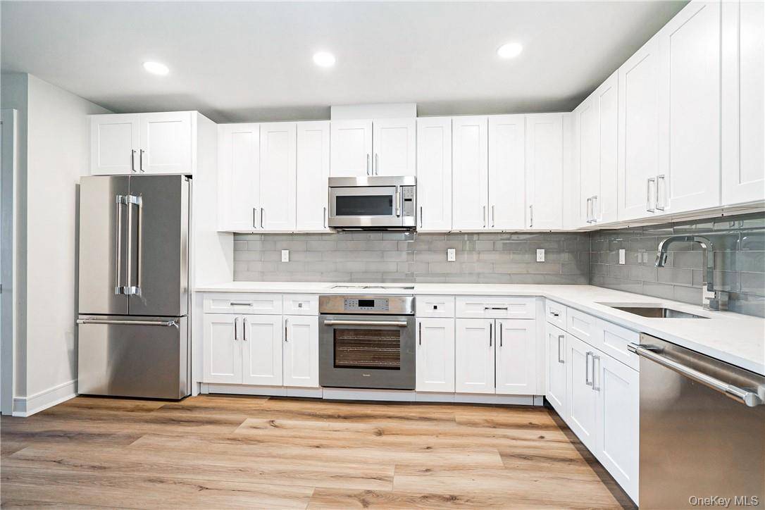 Welcome to The Townhouse on Purdy a stylish red brick building tucked away in the heart of Harrison.
