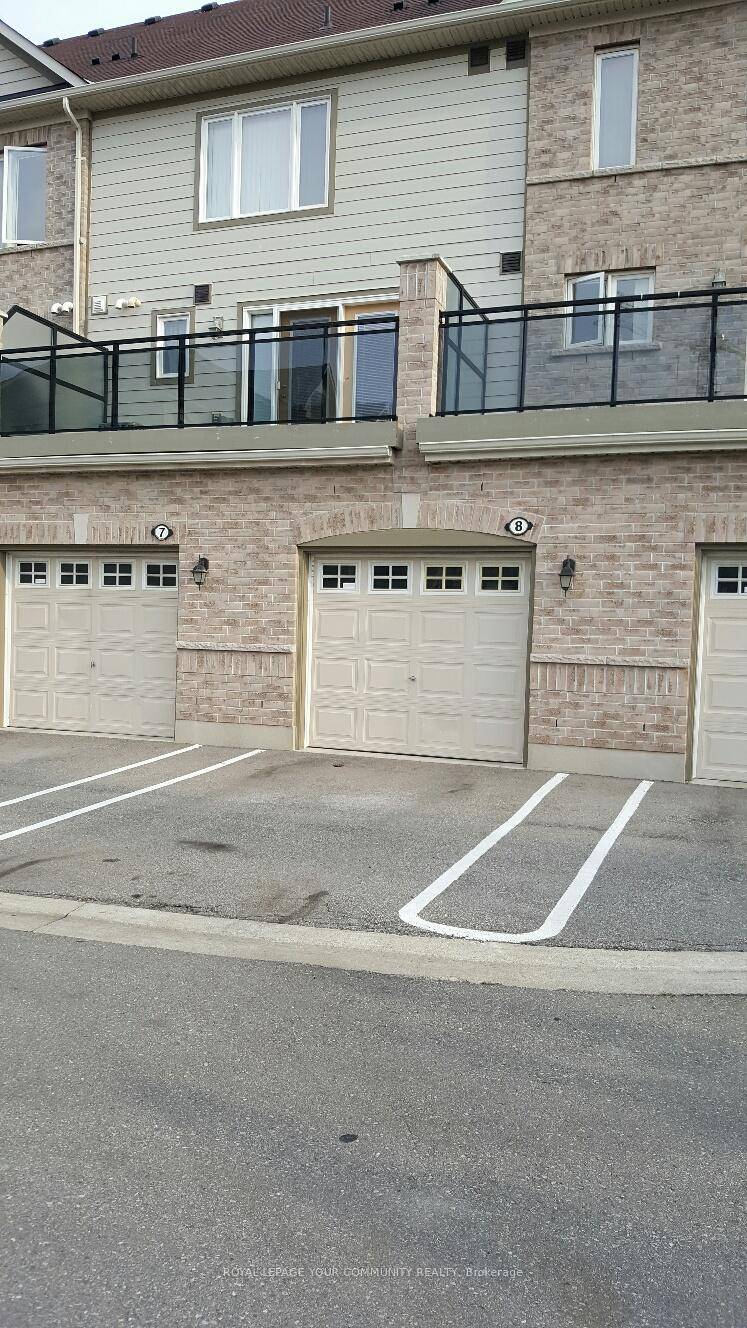 Spacious 1 bedroom corner unit condo townhouse offering 661 sqft of ground floor living with direct entry from a built in garage plus a driveway 2 parking spaces included.