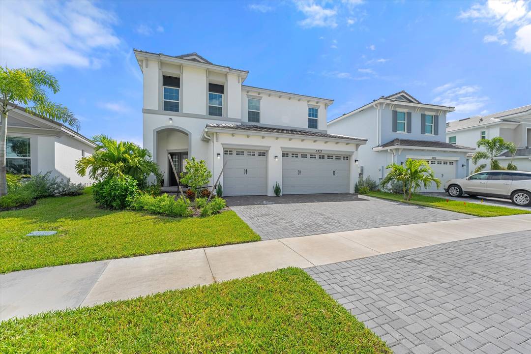 Welcome to this stunning Laurel Model two story home with a balcony in the highly sought after Orchards community in Westlake, Florida.