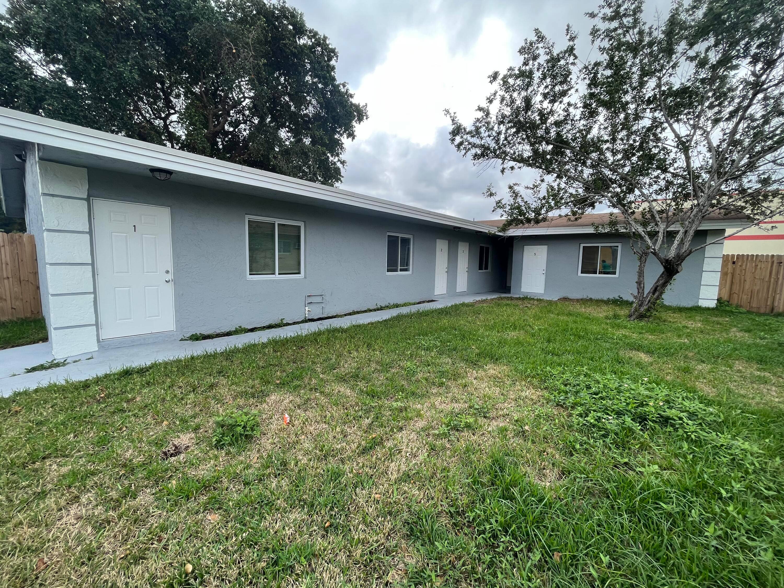 Completely restored and remodeled modern 5 unit CBS apartment building.