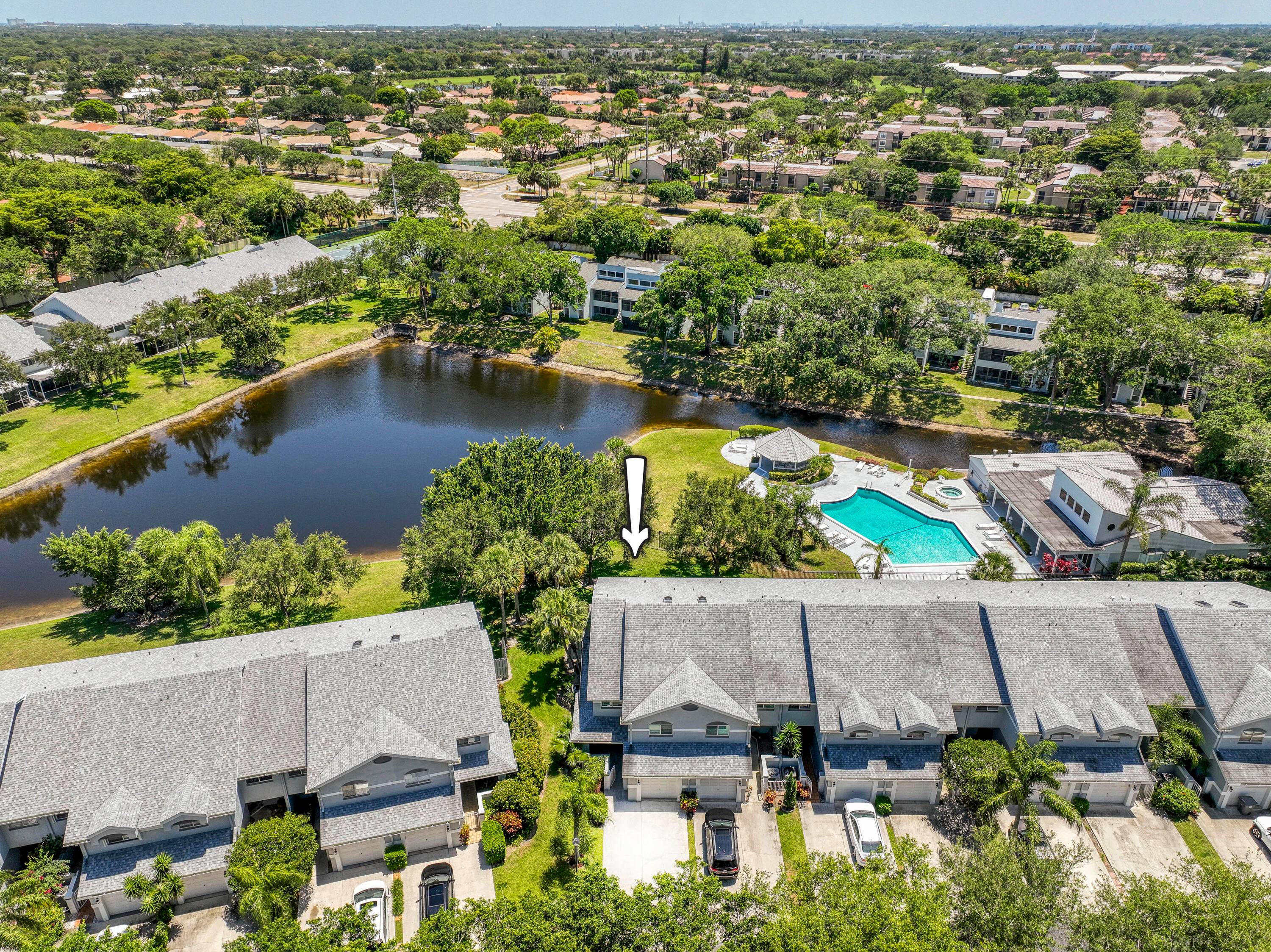 Beautifully updated LAKEFRONT townhome with a NEW roof located in the sought after Boca Park community of Boca Del Mar.