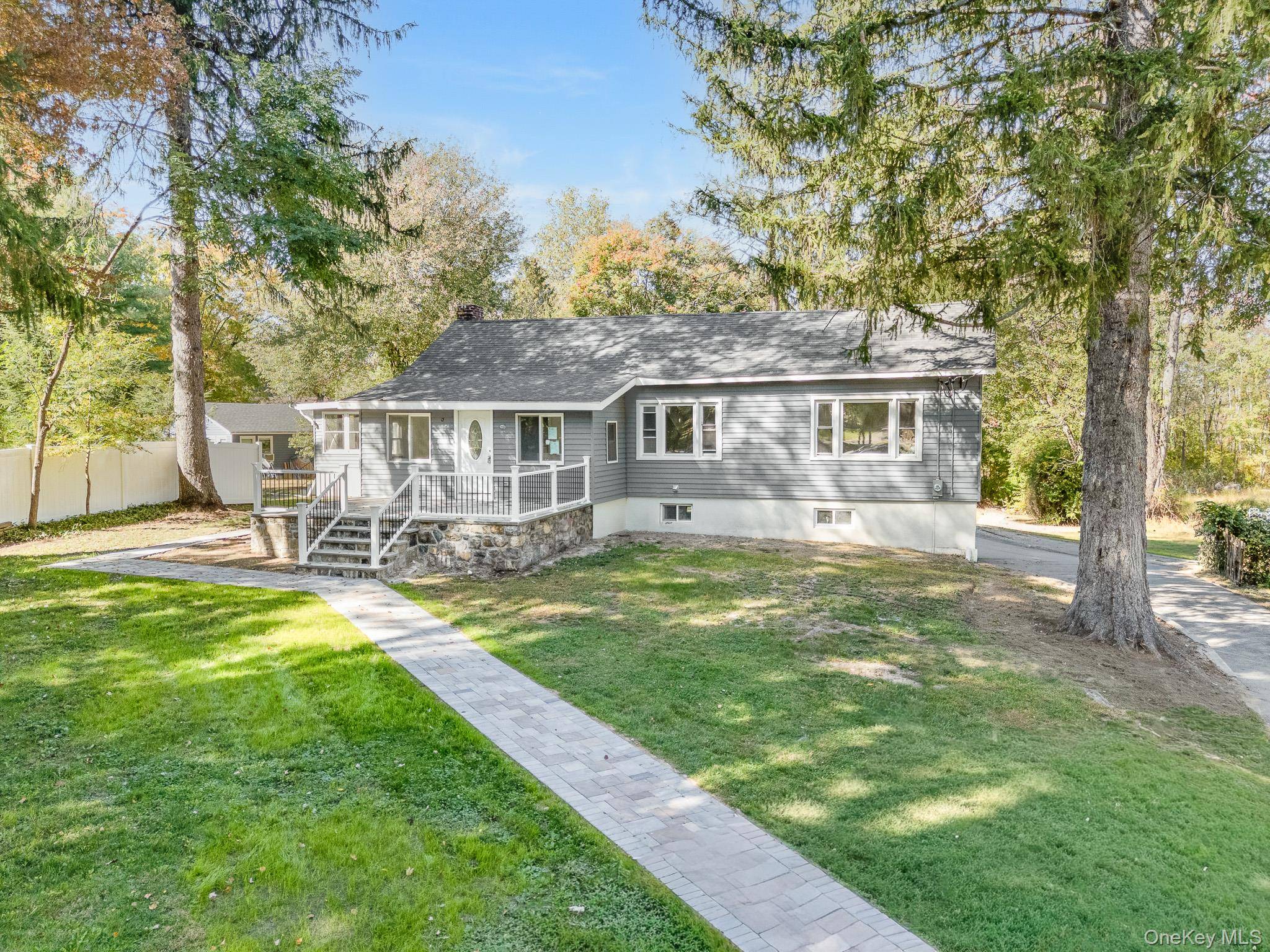 Nestled on nearly one acre of lush, private grounds in the desirable Yorktown area, this fully renovated 3 bedroom, 3.