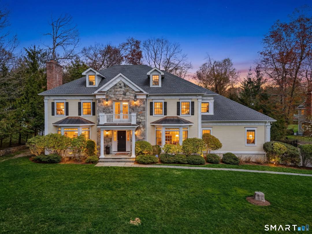 Elegant Colonial set on a private, beautifully landscaped acre in North Stamford.