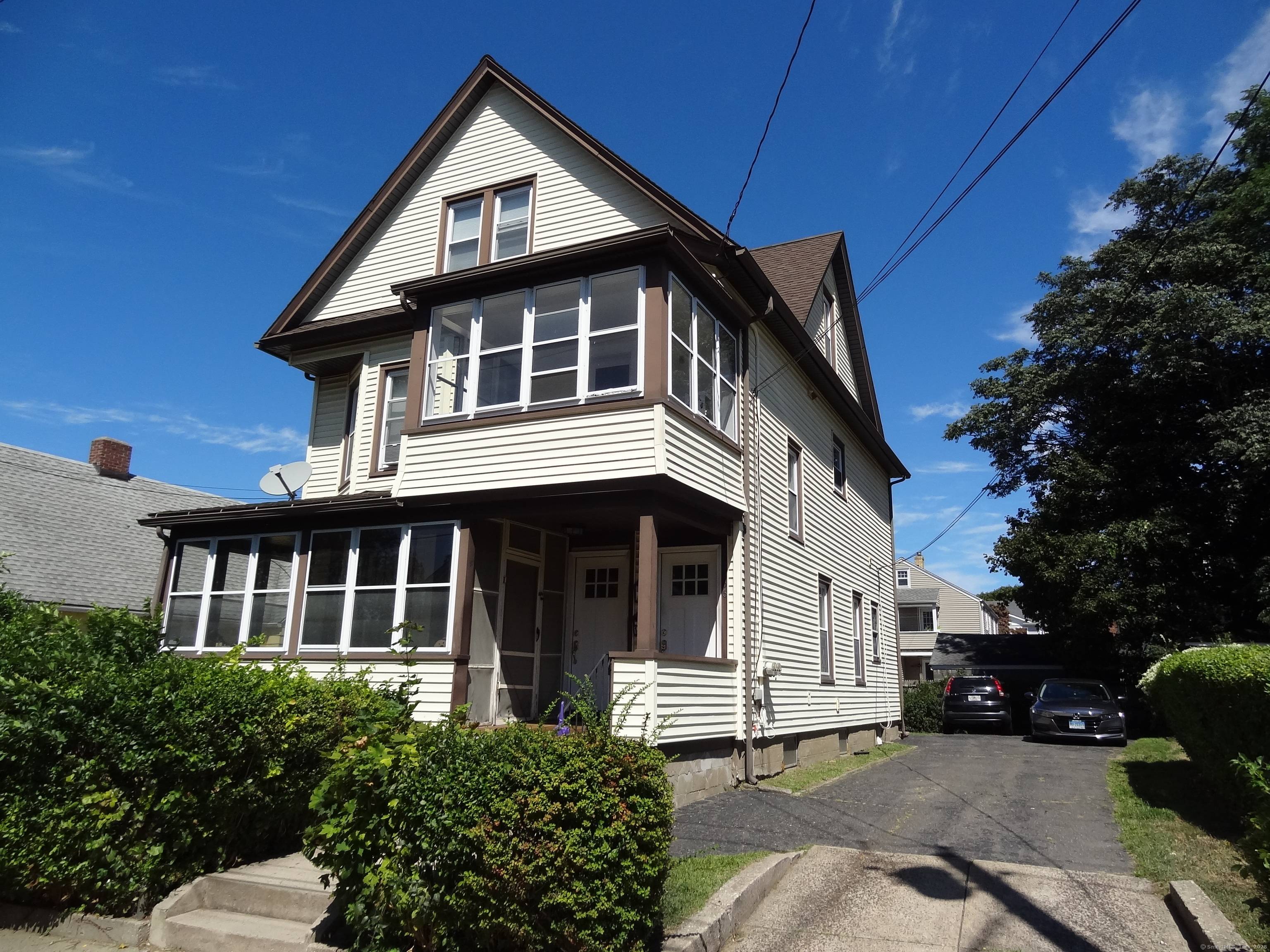 Great Black Rock legal two family home with a third floor accessory apartment currently being rented with the second floor.