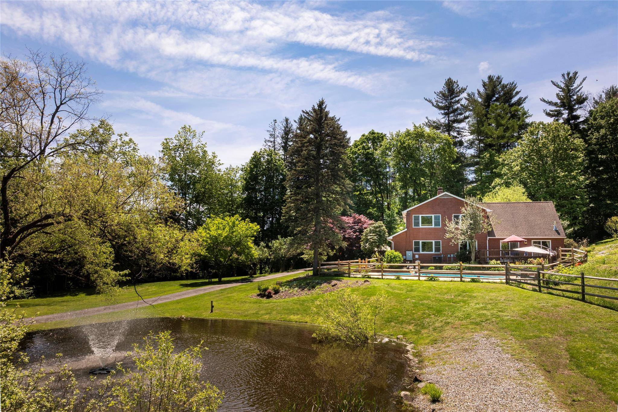Set on beautifully landscaped grounds, this 4 bedroom, 3.