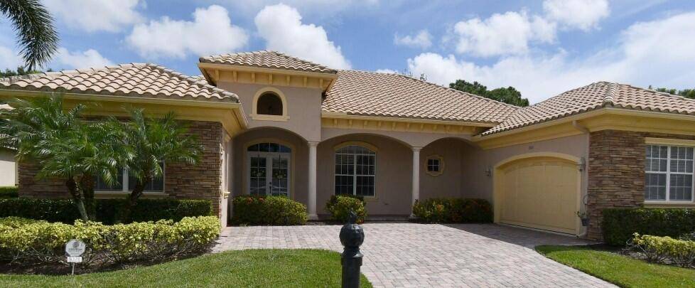 Stunning 4BR 3. 5BA den pool home in sought after PGA Village with serene lake golf course views !