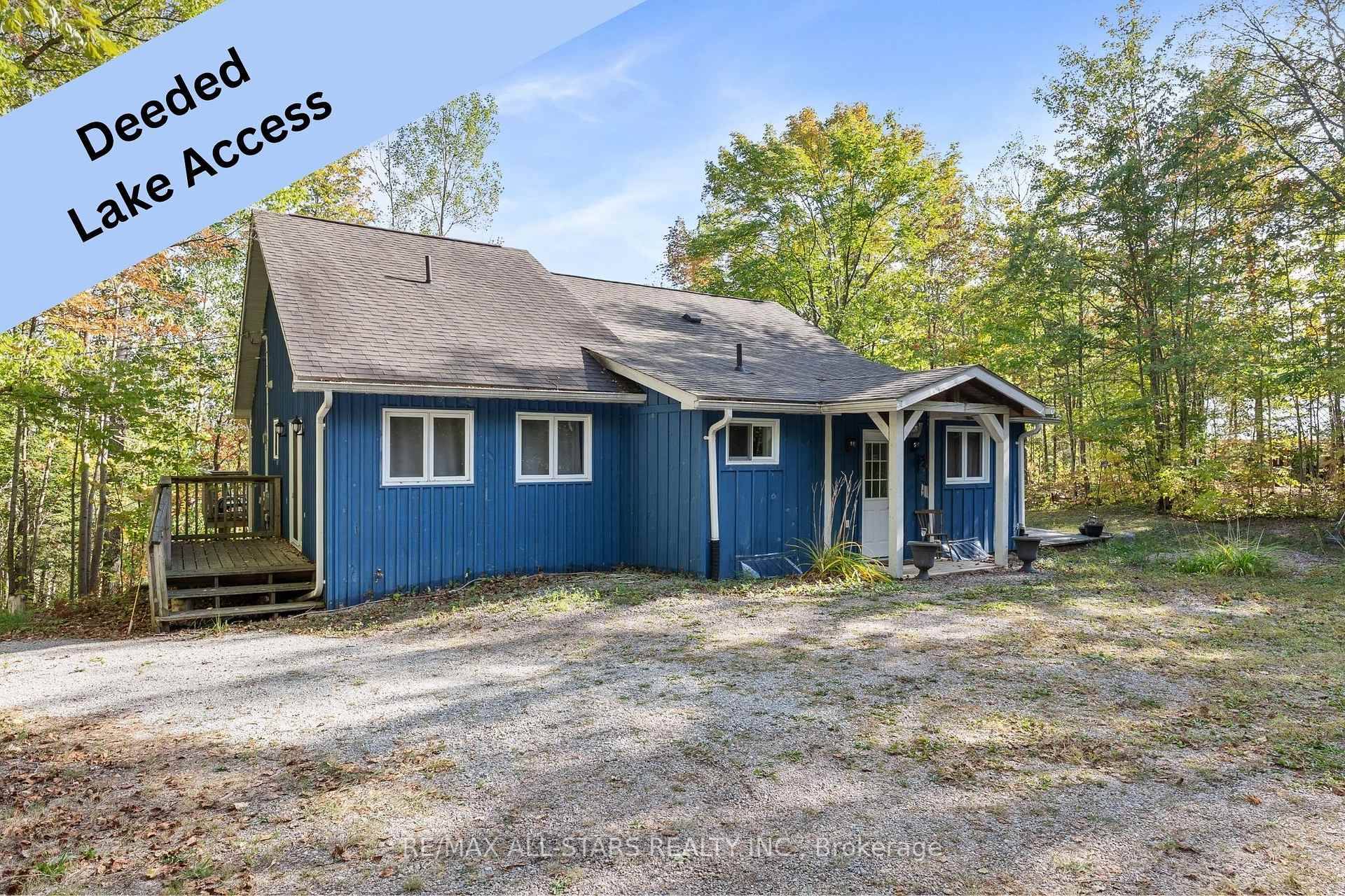 This 3 bedroom, 2 bath bungalow is full of cottage country charm and sits on a beautifully treed 1.