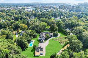 Walk to town from this fully renovated great Greenwich estate, majestically sited on 3.