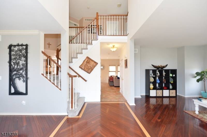 Welcome to this elegant traditional Colonial nestled in the desirable Reservoir Point, offering exceptional privacy on just over an acre of beautifully positioned property backing up to High Mountain.