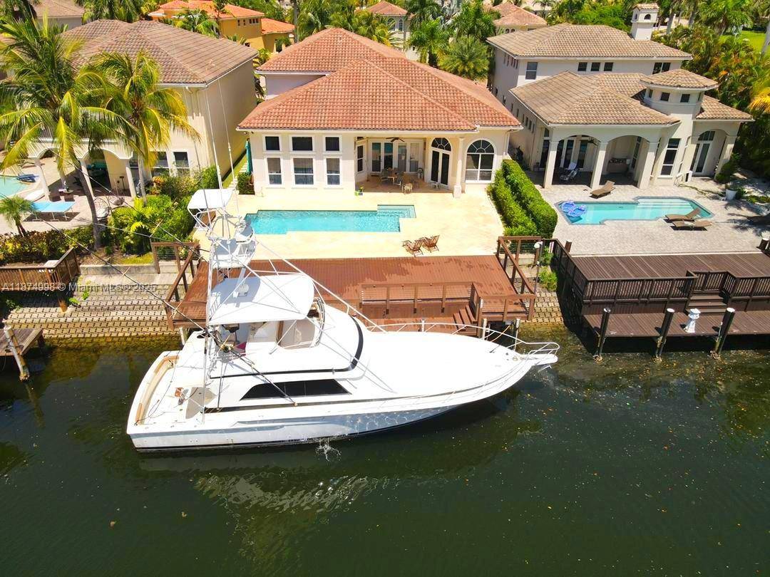 Exclusive Harbor Islands Waterfront Estate Located in the prestigious, 24 hour gated Harbor Islands community, this stunning 4 bedroom Den, 5.