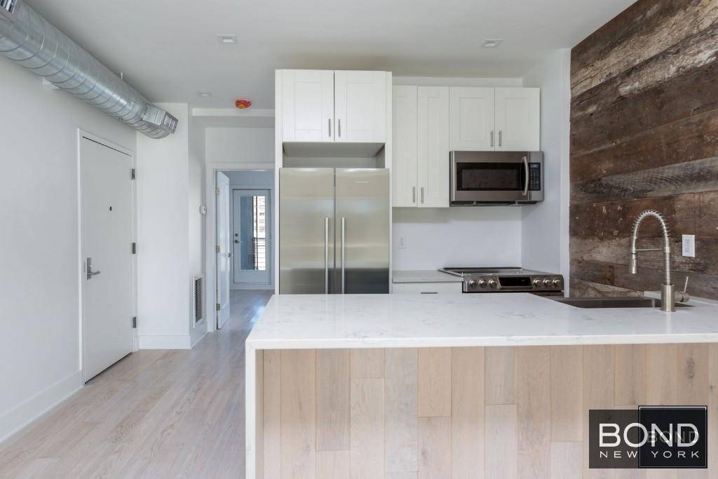 This is an absolutely stunning 2 level apartment loaded with light, high ceilings, style and all the comforts of a home !