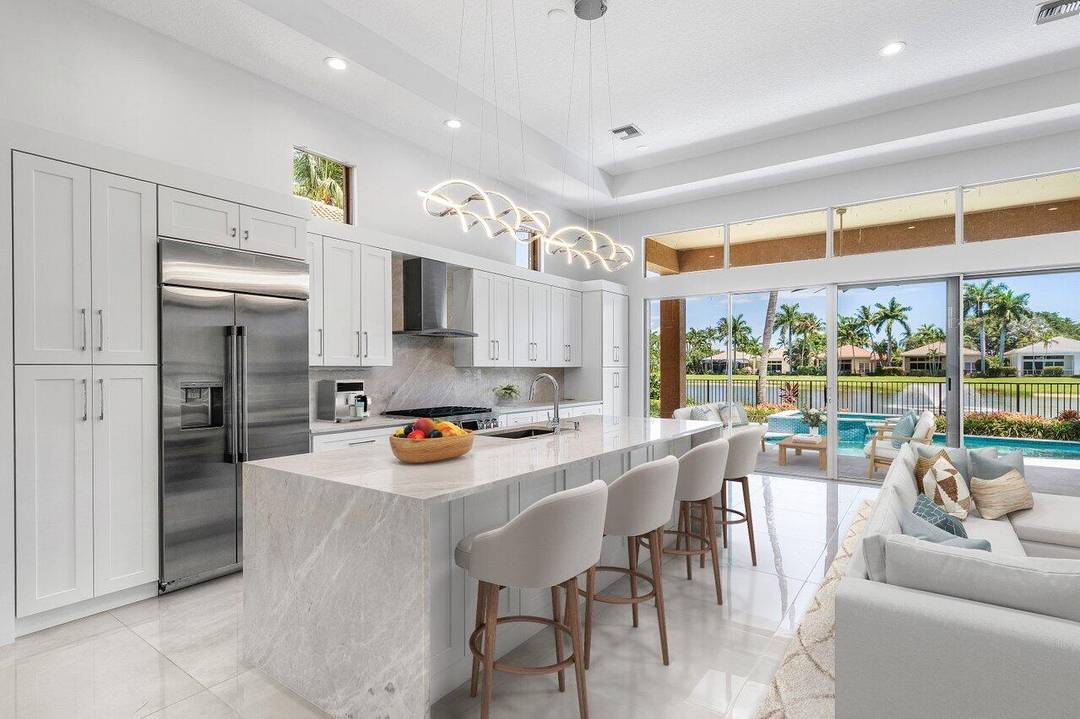 Beautifully renovated single story home available in Ballenisles with gorgeous lake views !