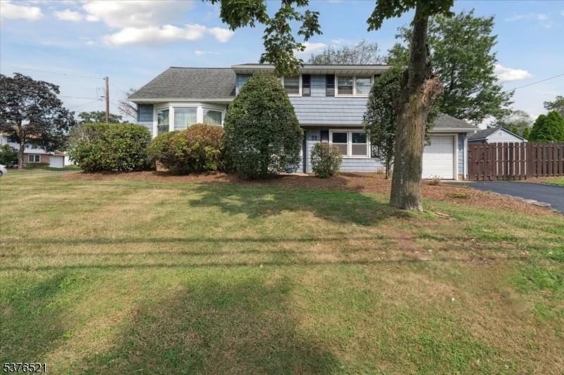 Beautifully updated 4BR, 2BA split level home in Middlesex with a flexible 4 level layout.