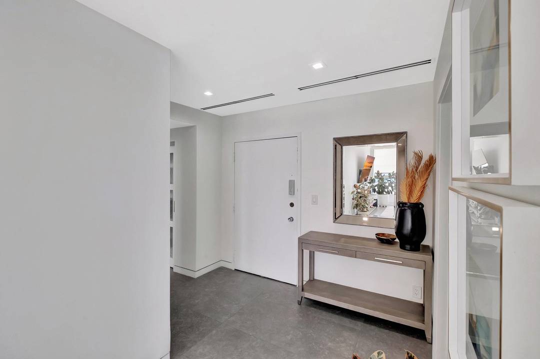 Welcome to your dream oceanfront lower penthouse condo, where modern luxury meets coastal living.