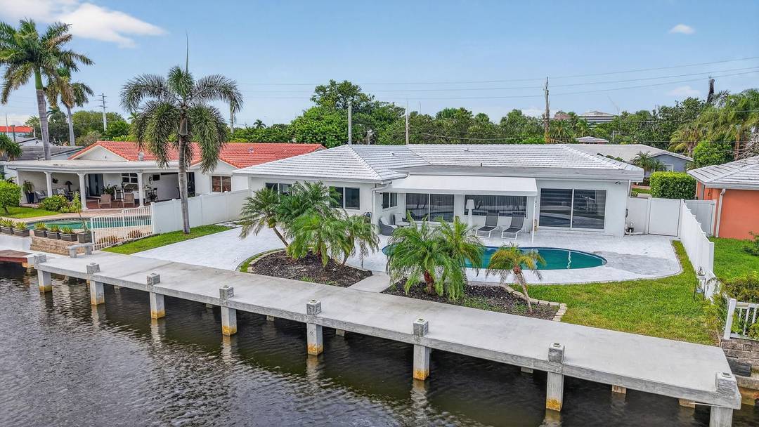 Nestled in The Landings, this fully renovated waterfront home has been meticulously crafted.