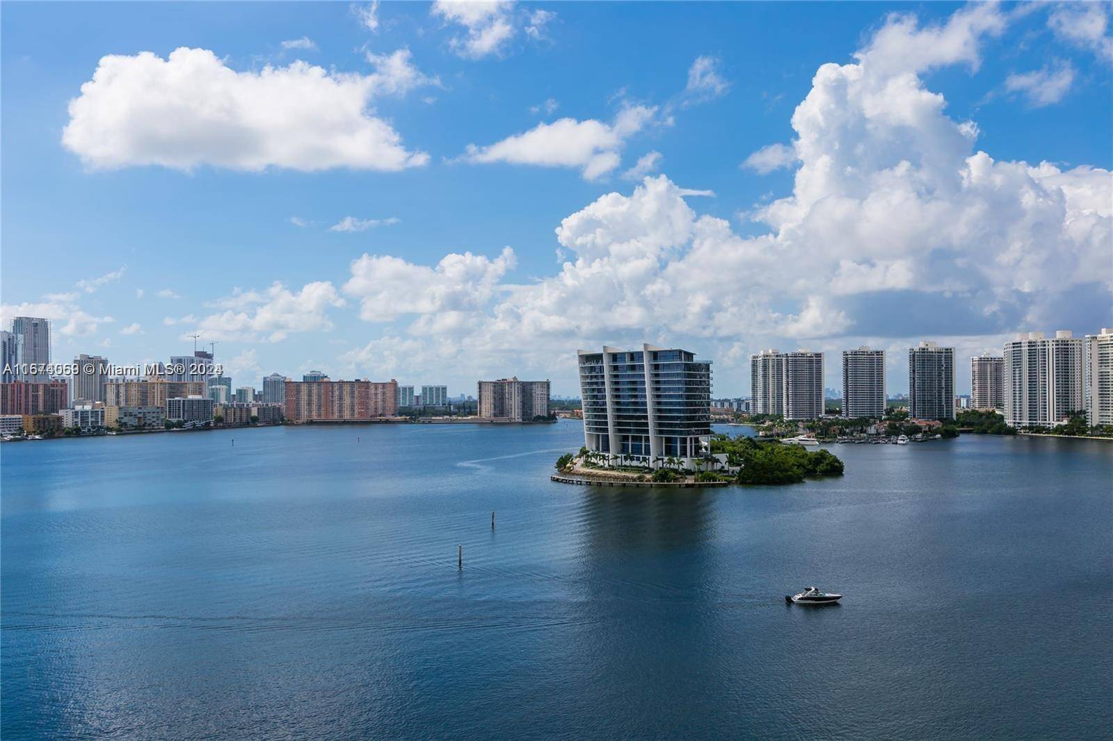 This contemporary corner condo in Mystic Pointe 300 offers breathtaking intracoastal and water views, creating a serene retreat.