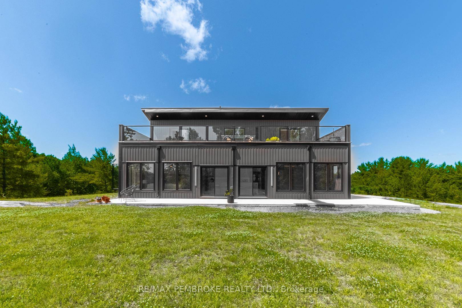 This Scandinavian style chalet is perched atop the rugged Canadian Shield offering sweeping views of the tree tops and glimpses of the Petawawa River.