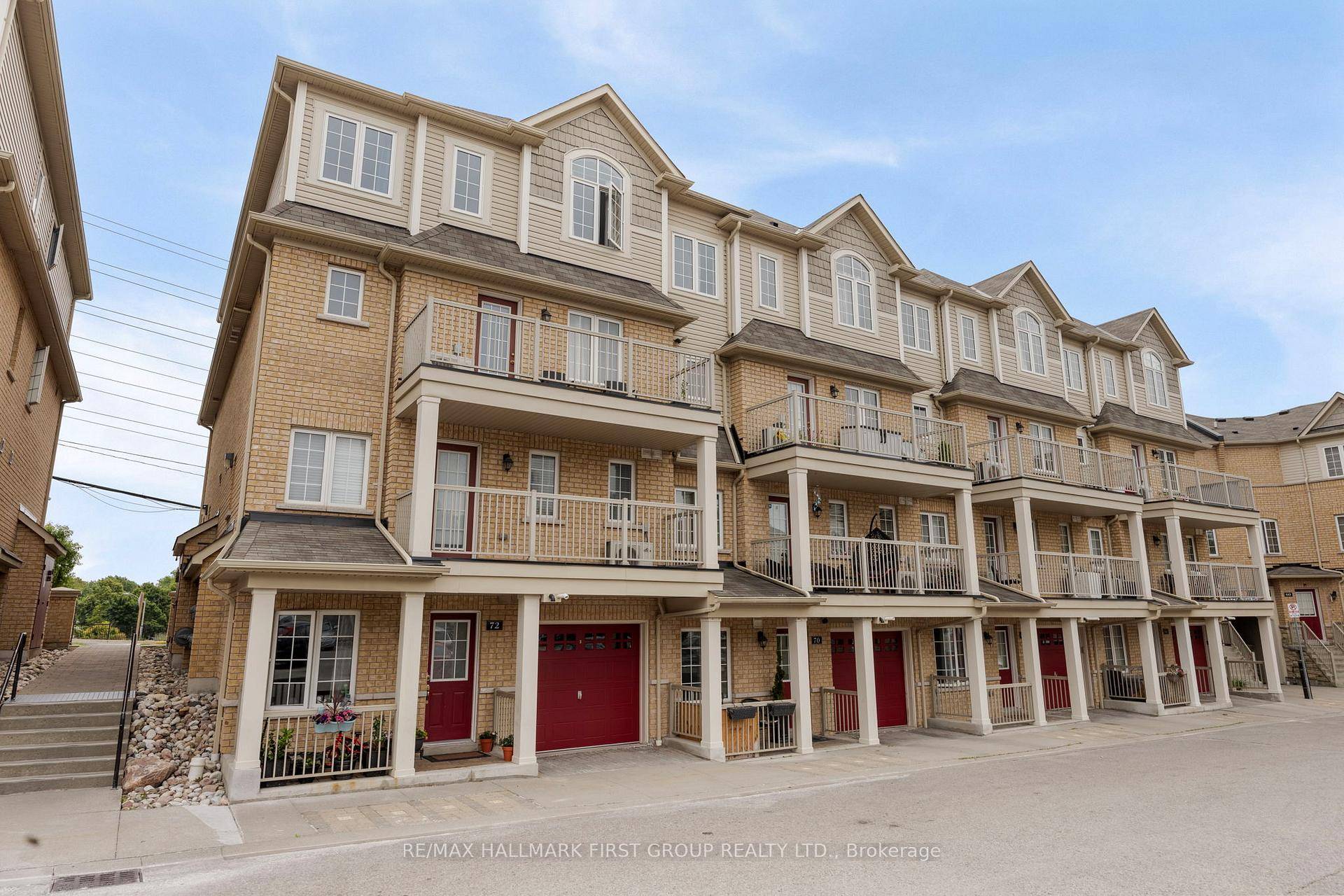 This modern 2 bedroom, 1 bathroom stacked condo townhouse offers sleek black finishes, hardwood floors, pot lights, and a stylish kitchen with stainless steel appliances, a sleek backsplash, and updated ...