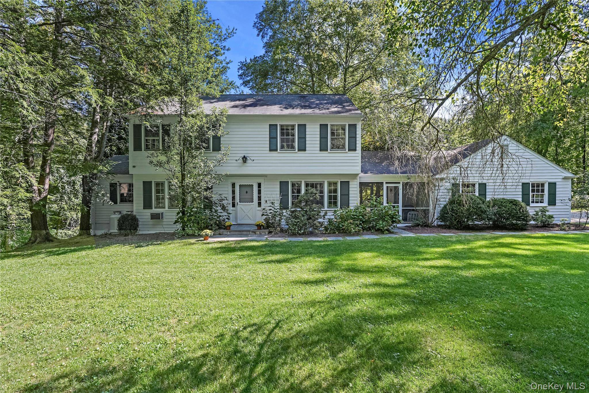 This classic center hall colonial set on 3 plus acres with a gunite pool in the Bedford Central school district has superb curb appeal amp ; charm.