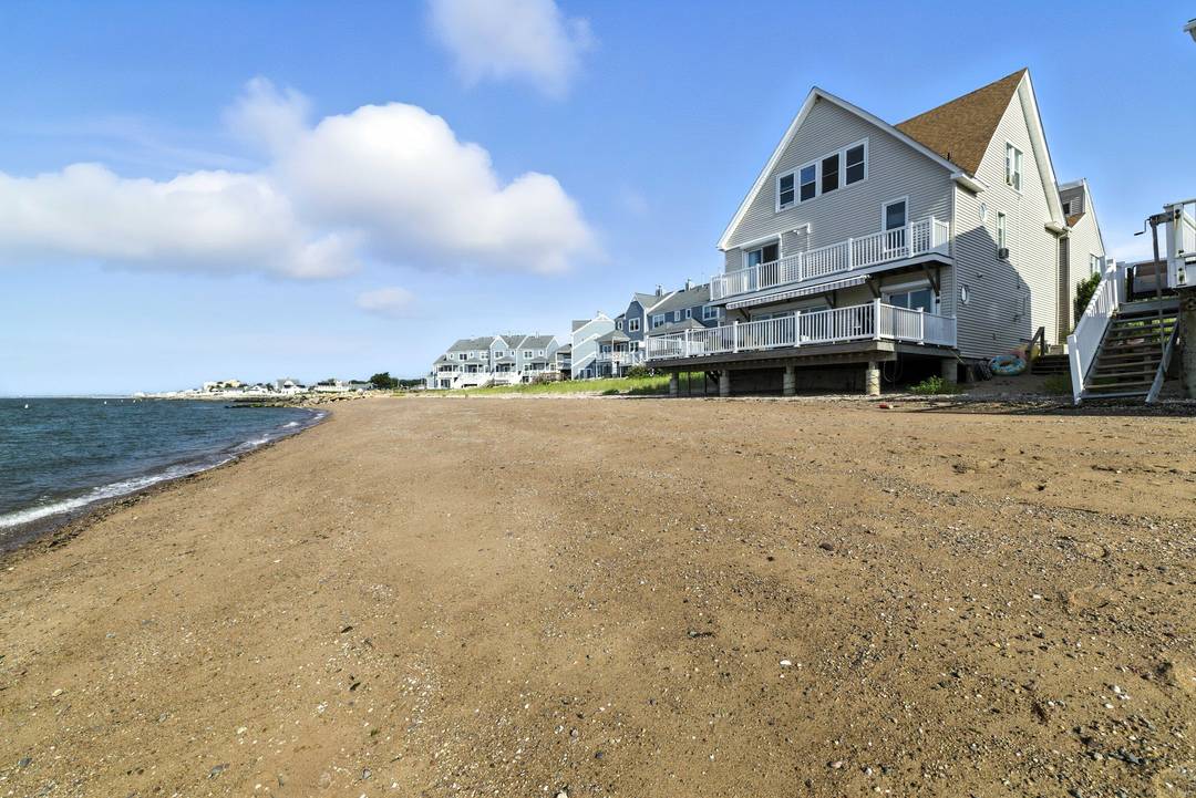 Spend your summer soaking up the sun at this exceptional, fully furnished waterfront retreat located on one of Cosey Beach Ave's most sought after sandy lots.