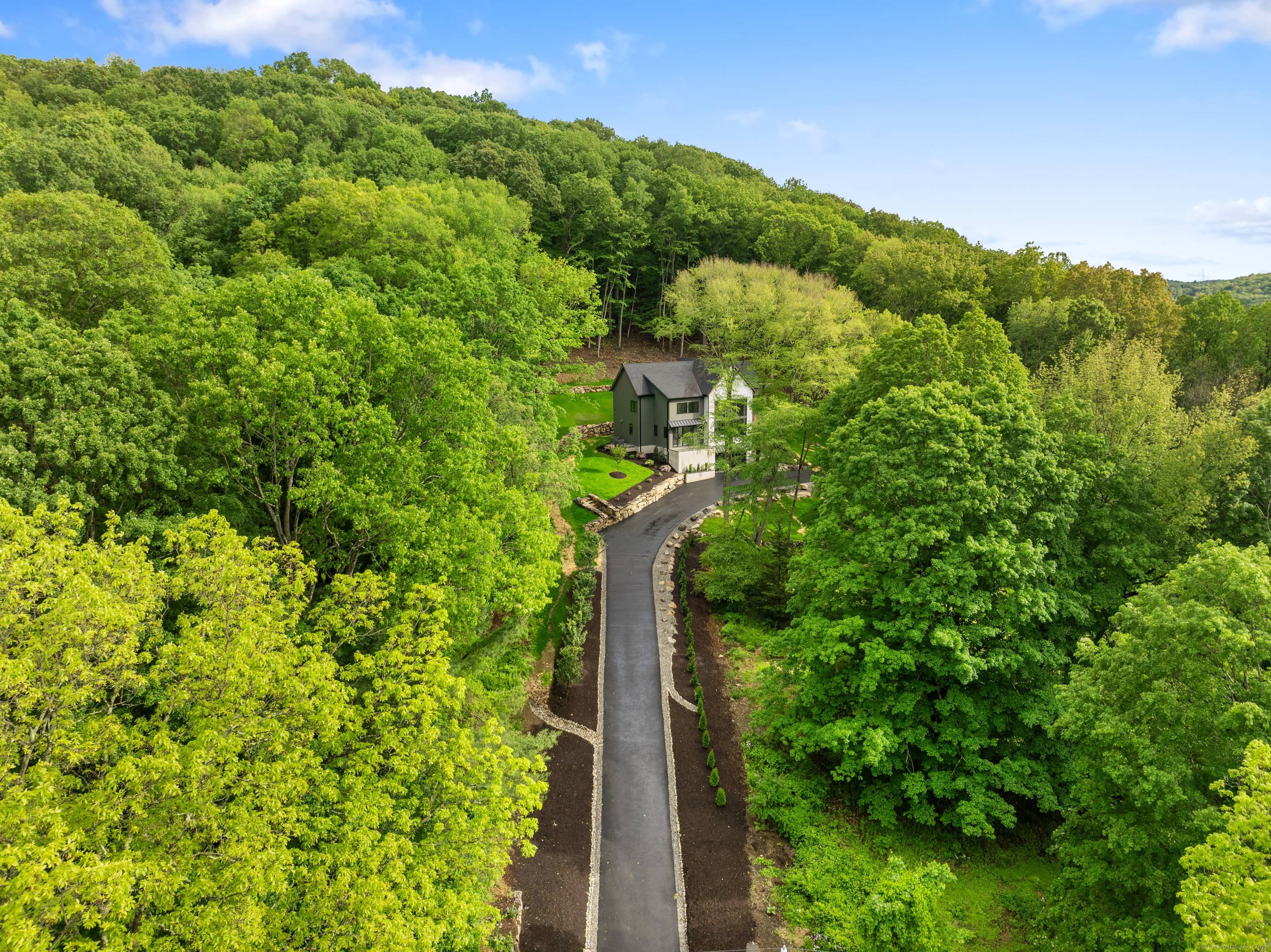 A masterpiece of modern design and natural harmony, this one of a kind new construction home in Redding, CT is unlike anything else on the market.