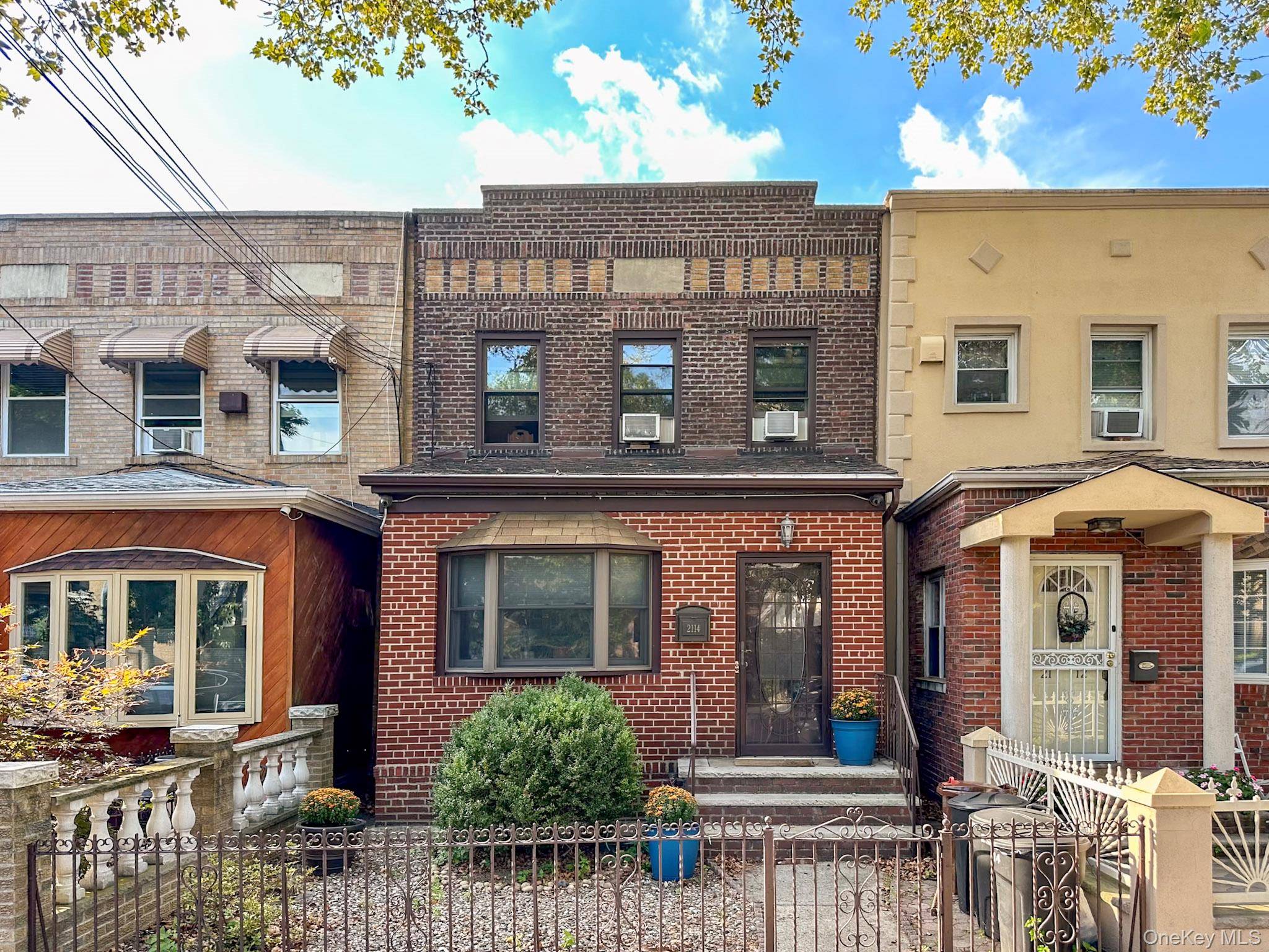 This charming, legal two family brick home, currently configured as a single family residence, boasts 3 bedrooms and 2.