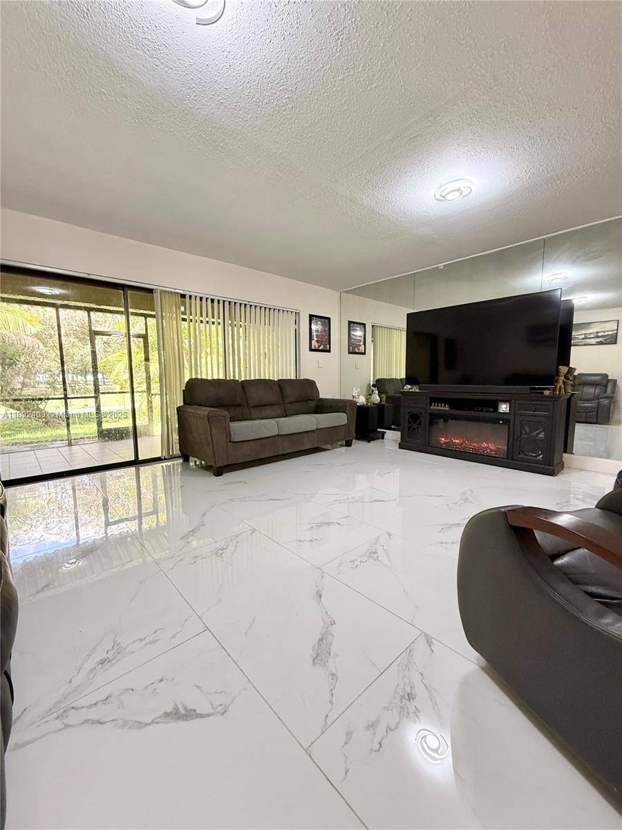 Beautiful two story townhouse located in the private, gated community of Costa del Sol in Doral.