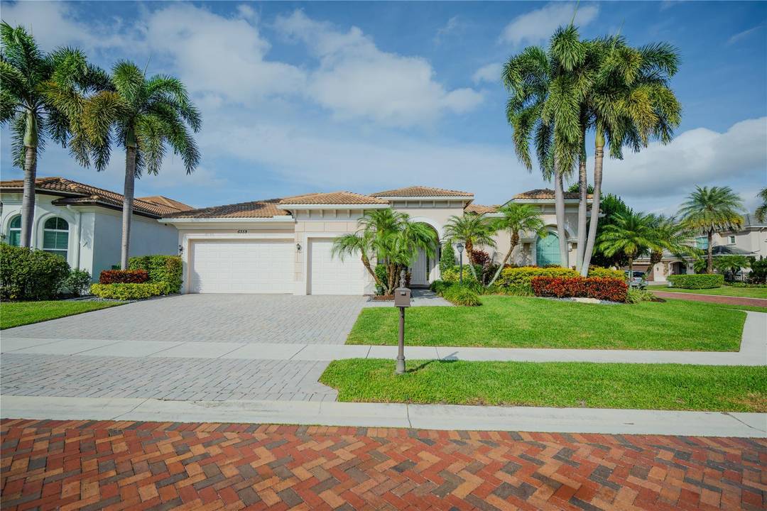 This beautiful one story home is located in the exclusive gated community of Azura, Boca s prestigious Millionaire s Road.