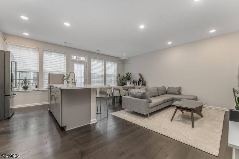 Premium nature preserve views are yours to enjoy from this smart and stylish townhome in Pulte's Somerville Station !