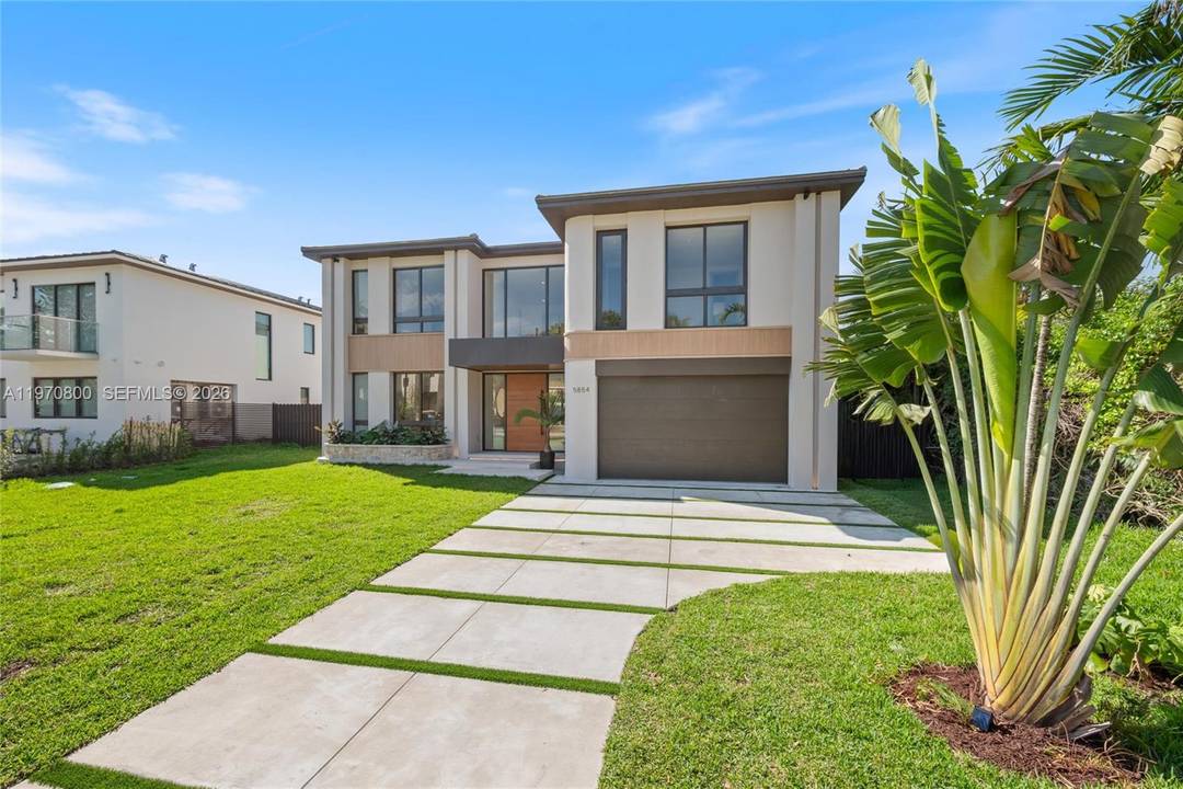 New construction two story single family home featuring 5 bedrooms and 6 bathrooms, offering 3, 904 SF of living space and a two car garage.