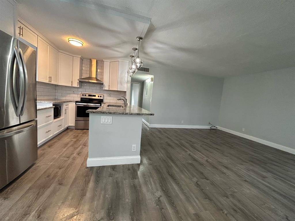 Updated 2 2 Villa. Garden views and enclosed patio, SS appliances, granite counter tops, recent floors, bathrooms, showers, and fixtures throughout.
