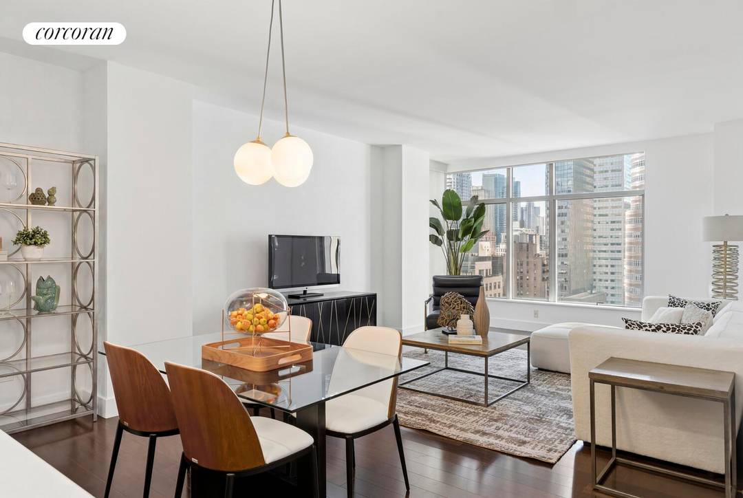 Immaculate high floor corner two bedroom, two bathroom residence in one of Midtown East's most desirable condominium buildings !