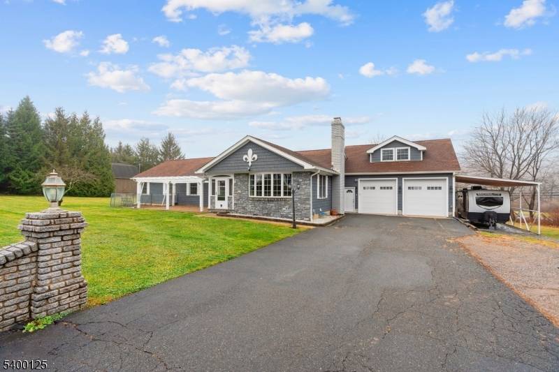 Move in ready custom built expanded ranch offering approximately 2, 160 sq ft of living space, plus an additional 560 sq ft finished basement, set on nearly one acre.