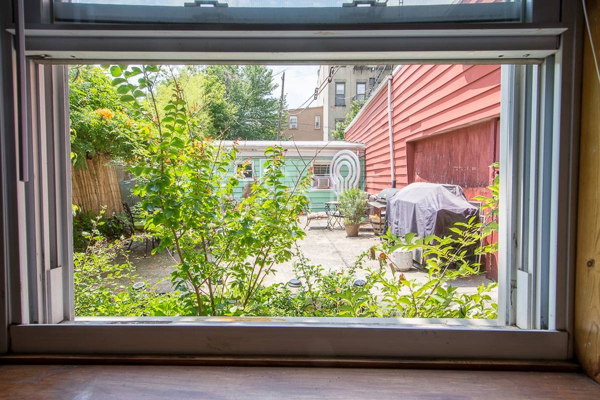 This 3 Bedroom home takes up the entire floor of this petite residency facing both the front of the property as well as the lush courtyard and garden out back.