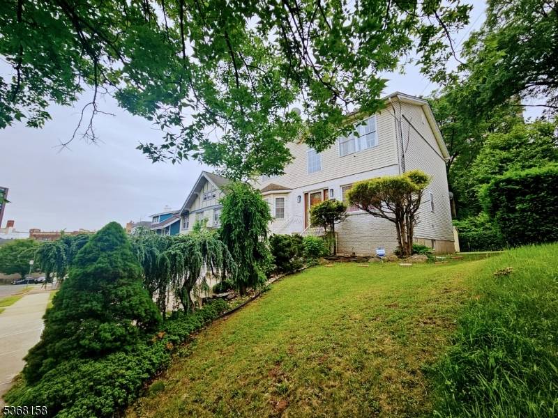 Single family living at its finest awaits you at 30 32 Custer Ave !