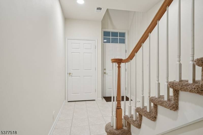 This high end, contemporary three bedroom and two and half bathroom townhome features an open concept layout, beautiful moldings, and hard wood floor throughout on the 2nd floor.