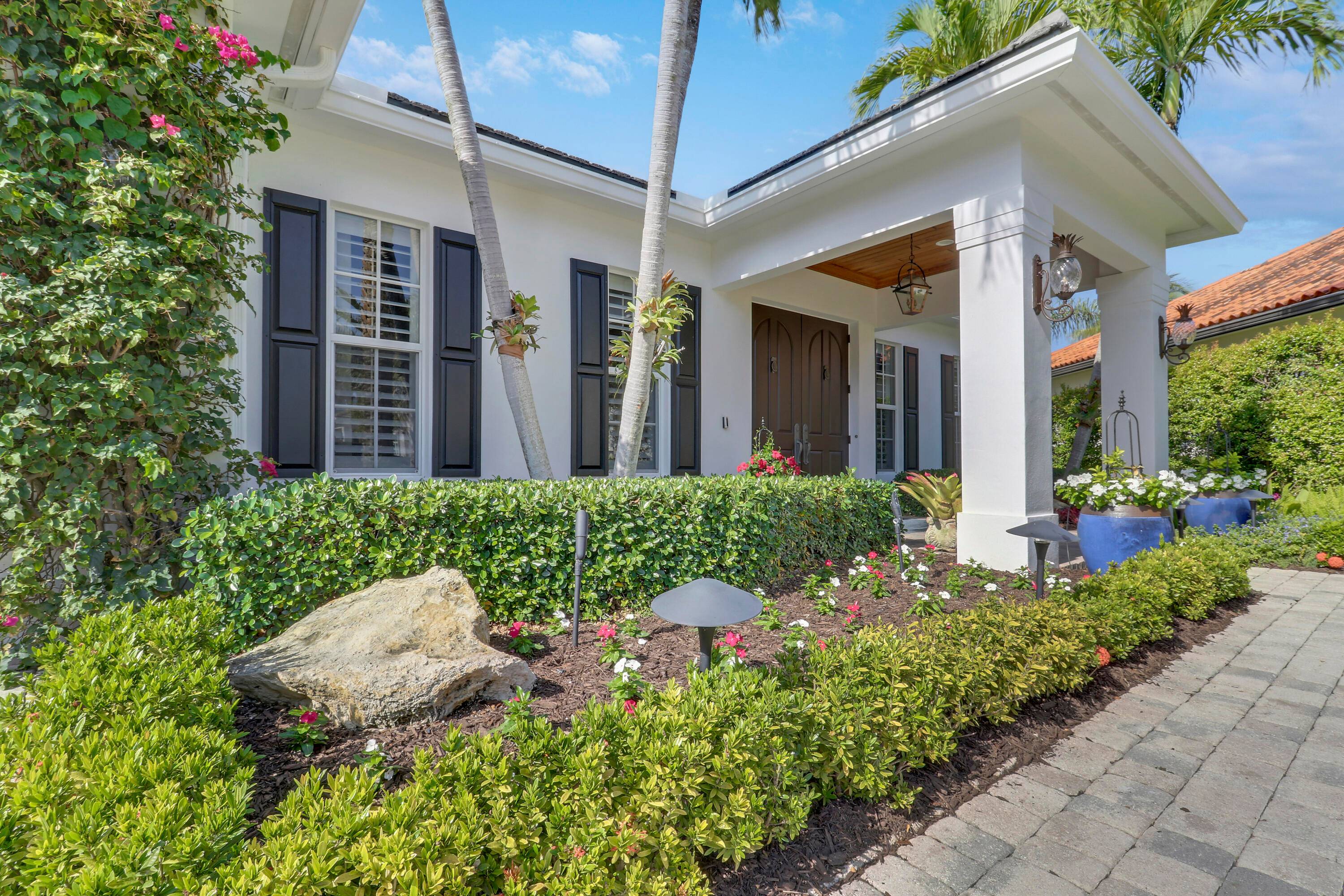 Welcome to 10841 SE Arielle Terrace, an exquisite residence nestled in the exclusive gated enclave of Waters Edge.