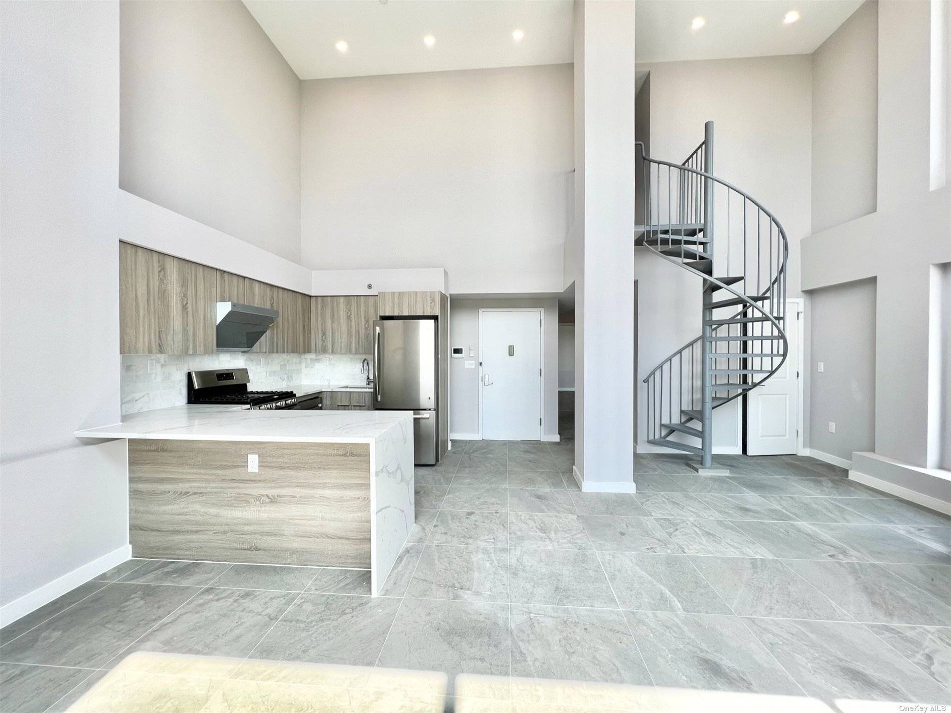 Featuring two of the most remarkable terraces in the city, this two bedroom, two full bathroom duplex is an unrivaled East Elmhurst in a contemporary condominium building.