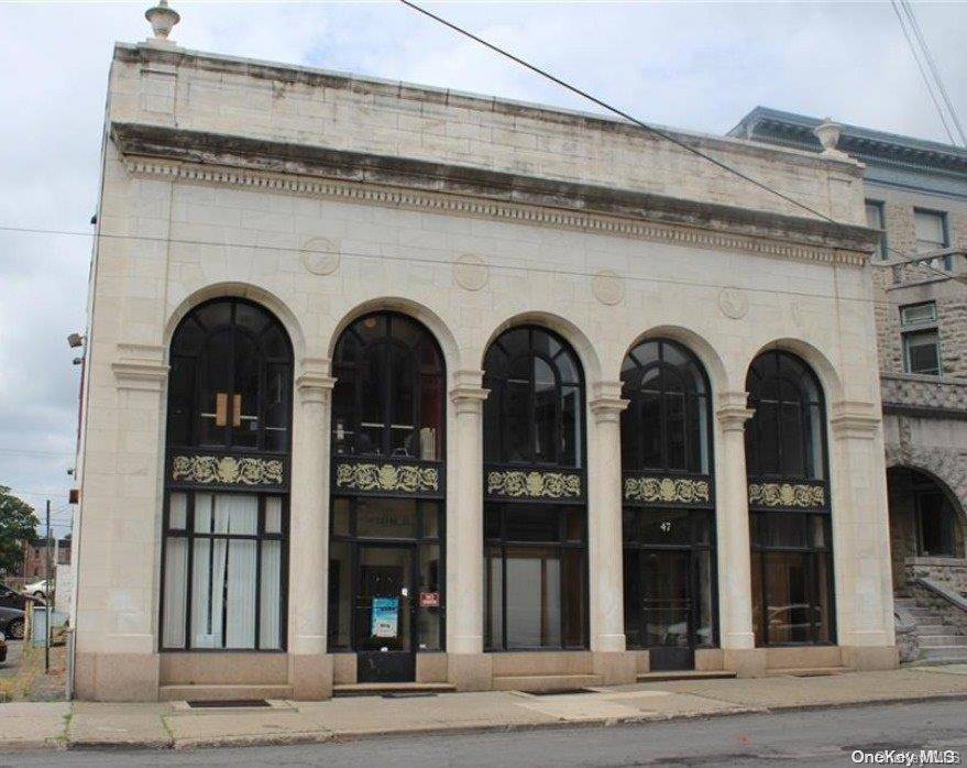 A truly unique opportunity to secure this former bank which contains Soaring Ceiling Heights complemented by its Marble and Granite interior.
