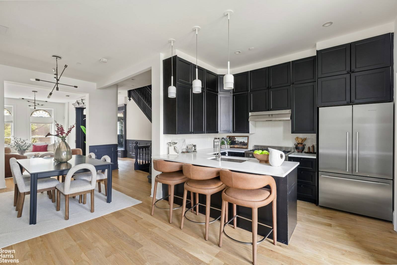 Soak up the sun and skyline views from your private rooftop deck, accessed via a fully retractable skydoor just one of the many standout features of this meticulously updated brownstone ...