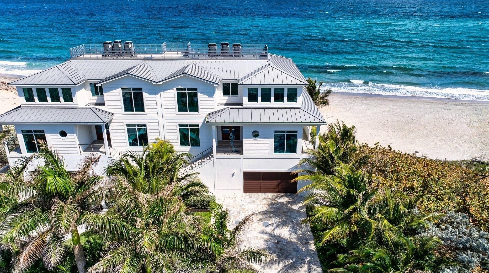 Ocean Ridge townhome, right on the sand, features a sundeck and two sunrise wraparound balconies.