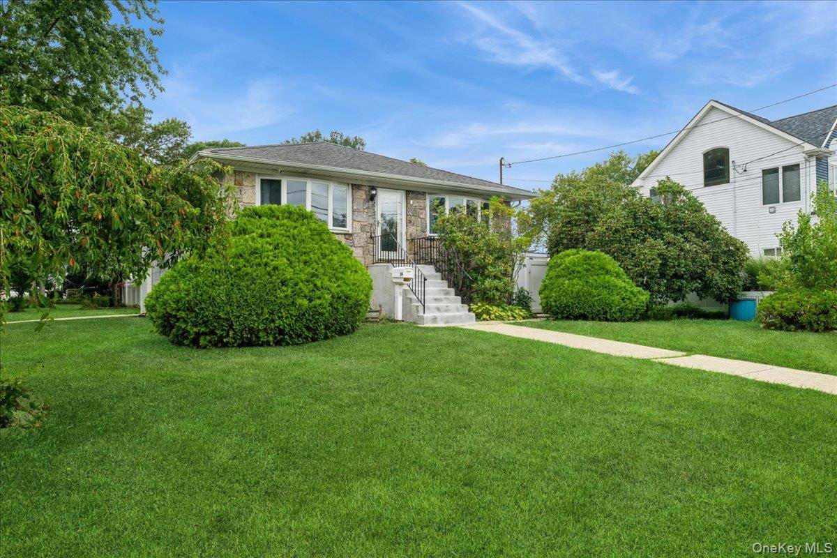 This home sits on a corner lot and offers a total of 5 bedrooms and 3 full bathrooms.
