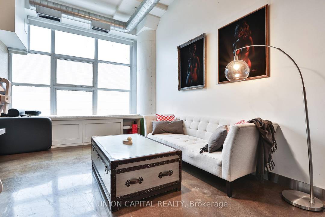 Set within the iconic Merchandise Lofts, where historic character meets modern downtown living, this furnished 1 bedroom suite with parking offers the perfect blend of space, light, and lifestyle.