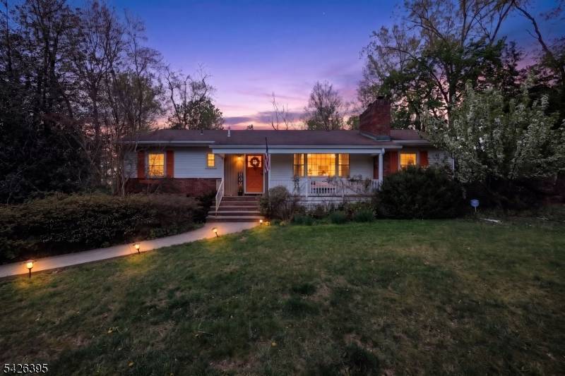 Enjoy the four seasons in this spectacular ranch style home with a beautiful wood burning fireplace in the formal living room and a second fireplace in the large family room ...