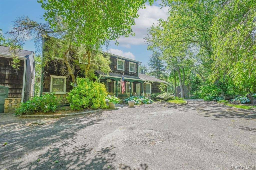 Beautiful Colonial Set Back on One Private Acre on a Tree Lined Cul De Sac.