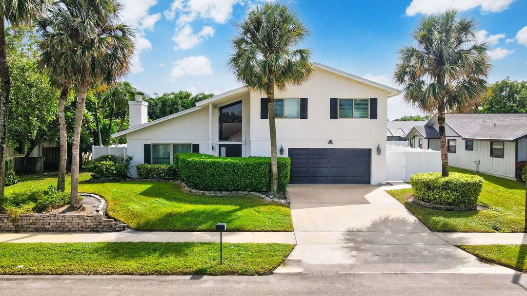 Discover this exceptional home in the highly sought after East Boca's Pinelands North with no HOA.