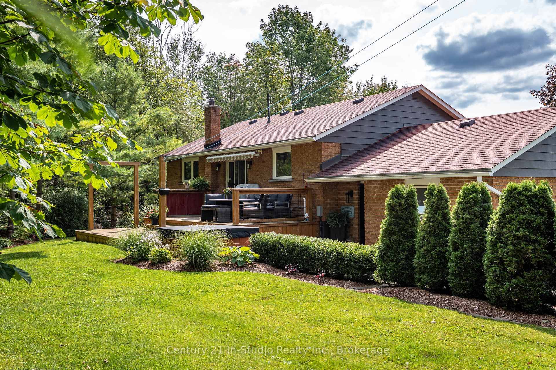 Picture yourself coming home to wide open space, privacy, and a beautifully updated bungalow on 1.